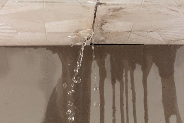 Professional Flood Damage Cleanup technician working in Marshall, CA